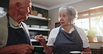 Senior, couple and talking with coffee in kitchen to help chef with cooking breakfast or brunch in retirement. Elderly, man and woman together in home with conversation about morning or drink