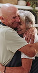 Senior, couple and hug in kitchen with love, support and care in marriage and retirement. Elderly, man and woman embrace with kindness or gratitude for cooking in home together with happiness