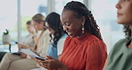 Happy, black woman and typing with phone in row for communication, networking or chatting in waiting room. African female person, intern or employee with smile on mobile smartphone for online texting