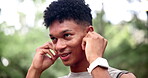Jogger, park and earphones with face, music and exercise for health and wellness. African man, runner and sports with training, workout and fitness for marathon with nature and forest and mindset