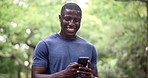 Fitness, phone and black man laughing in a park for social media, chat or location search in nature. Smartphone, app and runner in a forest with online comic, joke or meme, text and gif communication