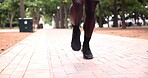 Fitness, legs or person running in park to exercise together for wellness, outdoor workout or marathon training. Closeup of a man, runner or healthy athlete on jog or race for cardio on the ground