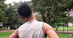 Fitness, neck stretching and man in park for outdoor morning workout in garden from back. Health, wellness and trees with athlete in nature for warm up, exercise and training challenge for body care