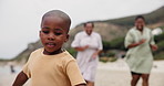 Happy, running and child on beach with parents for adventure on holiday, vacation and weekend. Black family, summer and child with mother by ocean for bonding, relationship and fun outdoors in nature