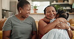 Hug, love and child with grandmother and mother on sofa laughing, playing and bonding together. Smile, relax and young girl kid embracing with mom and senior woman in living room at family home.