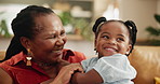 Happy, love and grandmother hug girl on a sofa with care, security or bonding at home together. Black family, support or senior woman in living room with kid for playing, laughing or babysitting fun