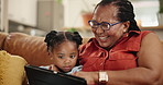 Love, tablet and grandmother hug kid on sofa with movie, streaming or Netflix cartoon at home. Digital, app or black family in living room watching video, film or bonding with games while babysitting