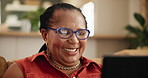 Tablet, glasses and senior black woman on a sofa reading ebook,  social media or meme gif at home. Digital, app and face of old African person with online comic, show or Netflix and chill in a house