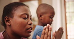 Mom, child and home for praying, faith and religion with learning, spiritual and speaking to God. African family, mother and kid with hands together for worship, hope and teaching of Christian prayer