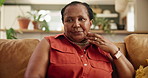 Senior African woman, thinking and home on sofa with ideas, memory or relax in living room in Kenya. Mature person, vision and remember on lounge couch with nostalgia, choice or decision in apartment