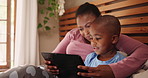 Bedroom, connection and mother with boy, tablet and typing with online video or digital app. Home, black family or mama with son or kid with technology or social media with child development or ebook