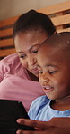 Home, black family and mother with son, tablet and typing with connection or social media. Apartment, parent and mama with boy or kid with tech or online reading with child development or digital app