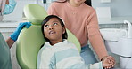 Kid, orthodontist and appointment for teeth or oral health education for prevention on tooth decay or hygiene. Little girl, mom and together for dentistry checkup or dental examination with dentist.