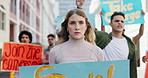 Outdoor, woman and group with protest, serious and voice with social justice for peace, strike and walking. People, community or activist with posters or banners with march or human rights to end war