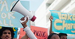 Street, posters and protest with megaphone, group and human rights march for peace, angry and social change. Support, crowd and outdoor in New York city or bullhorn with justice march for war to end