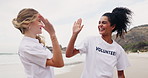 Happy woman, volunteer and beach with high five for recycling plastic bottle, bag or community service. Volunteering workers touching or collecting rubbish, dirt or garbage to save the earth or ocean