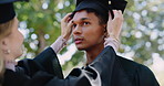 University, student and help with graduation cap at ceremony in park at campus event. Friends, achievement and proud man at college celebration for education, opportunity and development with support