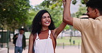 Happy, student and high five outdoor at college with friends to welcome and support studying on campus. Excited, energy and woman greeting man in park with social gesture of solidarity or community