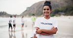 Happy woman, volunteer and beach with confidence to save the planet, earth or recycling in nature. Portrait of female person or cleaner with smile and arms crossed for eco friendly environment or sea