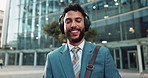 Face, businessman or headphones with city, commute or confidence to work by buildings. Proud employee, radio music or street with cbd or portrait of happy entrepreneur with career or job at corporate