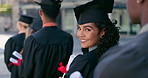 Education, graduation and face of woman with students at university in line with diploma, degree or scroll. Happy, pride and portrait of female person waiting with college certificate at school.