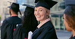 Smile, graduate and face of woman with students at university in line with diploma, degree or scroll. Happy, education and portrait of young female person waiting with college certificate at school.