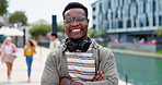 Man, face and smile in city with headphones or travel commute in street with streaming, entertainment or connection. Black person, portrait and downtown Chicago at water or radio, podcast or internet