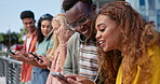 Group, students and smartphone for texting at university, mobile app and share with post, meme or web blog. Friends, men and women with phone for social media at college with connectivity in Atlanta