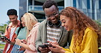 Group, students and phone for texting at college, mobile app and share with post, meme or web blog. Gen z friends, man and woman with smartphone, social media and funny chat at university in Atlanta