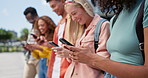 Hands, students and group with phone for texting, mobile app and typing for search, meme or web blog. People, men and women with smartphone for social media at university with connectivity in Atlanta