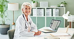 Senior, happy woman and doctor with documents for insurance, healthcare advice or service at clinic. Portrait of mature female person, cardiologist or medical professional with smile by office desk