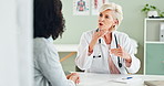 Woman, doctor or consulting with patient for healthcare advice, prescription or diagnosis at clinic. Female person, cardiologist or medical worker explaining process to client in consultation or help