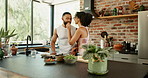 Health, feeding and couple with fruit salad in kitchen for vitamins, nutrition or diet breakfast. Smile, love and young man and woman preparing smoothie bowls together for wellness snack in apartment