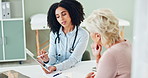 Woman, doctor and consulting patient with tablet for results, diagnosis or research at the hospital. Female person, cardiologist or medical employee talking to client with technology for consultation