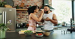 Smile, feeding and couple with fruit salad in kitchen for healthy, nutrition or diet breakfast. Hug, love and young man and woman eating smoothie bowls together for wellness snack in apartment.