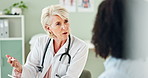 Senior woman, doctor and consulting with patient for healthcare advice, diagnosis or results at clinic. Female person, cardiologist or medical worker with client in consultation, health and wellness