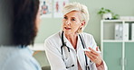 Senior woman, doctor and consulting with patient for prescription, diagnosis or results  at the hospital. Female person, cardiologist or medical employee talking to client for consultation or checkup