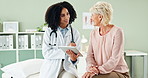 Happy woman, doctor and talking to patient with tablet for healthcare advice, diagnosis or results at clinic. Female person, cardiologist or medical worker with client and technology for consultation