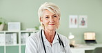 Smile, confident and face of senior doctor in office at hospital with pride for career. Happy, professional and portrait of mature woman healthcare worker with positive attitude in medical clinic.