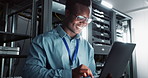 Happy man, technician and laptop in server room for database update, cyber security or code. Computer, smile and African engineer in data center for information technology, typing and programming