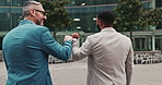 Businessman, fist bump and corporate city or professional teamwork or celebrating achievement, goal or deal. Male people, back and hand gesture at downtown building in New York, agreement or greeting