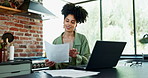 Laptop, documents and accounting with woman in kitchen of home for budget, investment or savings planning. Computer, finance or banking with young person at work in apartment for income or wealth