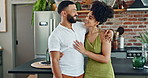 Kitchen, embrace and couple talking with smile from happiness of relationship, positive and love. Partners, woman and man together in apartment, discussion and hug with kiss as homeowners in house