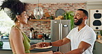 Couple, happy and dancing in home, kitchen and bonding for connection, love or laugh in morning with care. Dancer couple, steps and holding hands with spin, smile and embrace at apartment in Colombia