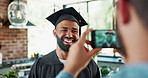 Graduate, student and laughing with photography in home with support, academic achievement and success. Graduation, man and friend with phone for celebration, social media post or memories in kitchen