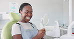 Happy, black woman and dental treatment with mirror for clean teeth, oral or gum care. Young African female person with big smile in tooth whitening, hygiene or healthcare with reflection at dentist