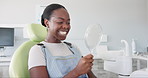 Happy, black woman and dental teeth with mirror for clean mouth, oral or gum care at dentist. Young African female person with big smile for tooth whitening, hygiene or healthcare with reflection