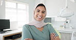 Muslim dentist, woman and happy with face, arms crossed and pride for career, healthcare and wellness. Person, dentistry doctor and happy with hijab for faith with confidence in medical workplace