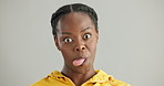 Happy, funny face or black woman with tongue out in studio for comic, playful or humor on grey background. Crazy, portrait or African lady model with goofy emoji for silly, joke or quirky personality