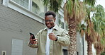 Excited, phone and winner in the city with man and text about achievement or work promotion. Mobile, outdoor and celebration with fist pump and happy African male person with tech and winning
